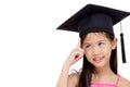 Happy Asian school kid graduate in graduation cap Royalty Free Stock Photo