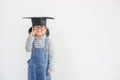 Happy Asian school kid graduate thinking with graduation cap Royalty Free Stock Photo