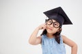 Happy Asian school kid graduate thinking Royalty Free Stock Photo