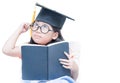 Happy Asian school kid graduate thinking with graduation cap Royalty Free Stock Photo