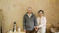 Happy Asian senior couple casual dress with sunglasses in vintage house