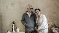 Happy Asian senior couple casual dress with sunglasses in vintage house