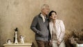 Happy Asian senior couple casual dress with sunglasses in vintage house