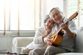 Happy Asian senior Couple enjoying Royalty Free Stock Photo