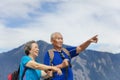 Happy asian senior couple hiking in nature Royalty Free Stock Photo