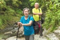 Happy Asian senior couple hiking in nature park Royalty Free Stock Photo