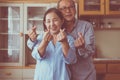 Happy asian senior couple showing hands heart shape together,Happy and smiling,Positive thinking Royalty Free Stock Photo