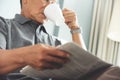 Asian senior man reading newspaper. Royalty Free Stock Photo