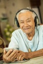 Happy asian senior man Headphones Royalty Free Stock Photo