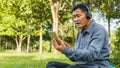 Happy asian senior man Headphones Listening Music Royalty Free Stock Photo