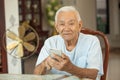 Happy asian senior man using the mobile phone Royalty Free Stock Photo