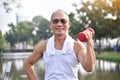 Asian Senior man lifting dumbbell. Royalty Free Stock Photo