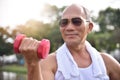 Asian Senior man lifting dumbbell. Royalty Free Stock Photo