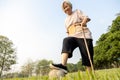Happy asian senior woman exercising has lost so much weight and excellent healthy with soccer ball,active female elderly playing