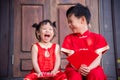 Happy asian siblings in chinese traditional costume