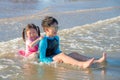 Happy siblings playing on the beach Royalty Free Stock Photo