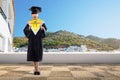 Happy asian student girl holding diploma scroll Royalty Free Stock Photo