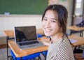 Happy asian Student girl  using  laptop in classroom Royalty Free Stock Photo