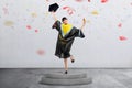 Happy asian student woman celebrate her graduation with confetti Royalty Free Stock Photo