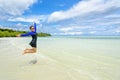 Happy asian teen girl jumping fun on the beach Royalty Free Stock Photo