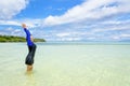 Happy asian teen girl play splashing water in the sea Royalty Free Stock Photo