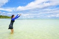 Happy asian teen girl play splashing water in the sea Royalty Free Stock Photo