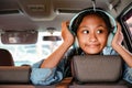 Happy Asian Teenage Girl Enjoy Listening Music in the Car