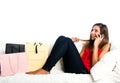 Happy asian teenage girl on the sofa, with bags Royalty Free Stock Photo