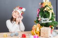 Happy asian thai child girl with Christmas gifts near a Christm Royalty Free Stock Photo