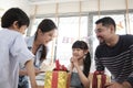 Young girl is surprised by a birthday party and celebrate with family together