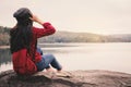 Happy Asian woman backpacker relaxing on holiday travel concept Royalty Free Stock Photo