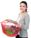 Happy asian woman with a basket of loundry Royalty Free Stock Photo