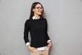 Happy asian woman in business clothes and eyeglasses looking away Royalty Free Stock Photo