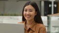 Happy Asian woman chinese korean japanese girl businesswoman working laptop in cafe multiracial office employee browsing Royalty Free Stock Photo