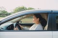 Happy Asian woman driving travel by herself