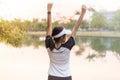 Happy asian woman enjoying and freedom with open hands,Female rise hands up enjoy nature outdoor Royalty Free Stock Photo