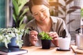 Happy asian woman gardener take care her green plant,Home gardening Royalty Free Stock Photo