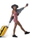 Happy Asian woman girl with suitcase and passport over white wall