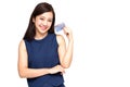 Happy Asian woman holding credit card or cash advances.