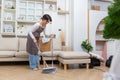 Happy asian woman holding with mop cleaning floor at home. Housekeeping concept Royalty Free Stock Photo