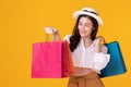 Happy asian woman holding shoppingbag with mid year sale