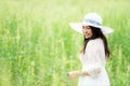 Happy asian woman lifestyle in meadow yellow flower sunrise. Active Outdoor Relax and enjoy in Nature.