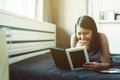 Happy asian woman looking photo album at home,Memory time photos,Happy and smiling Royalty Free Stock Photo