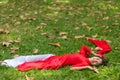 Happy Asian Woman Lying Down on Grassland