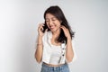 happy asian woman making a call using a cell phone Royalty Free Stock Photo