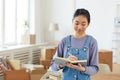 Happy Asian Woman Planning Moving to New House Royalty Free Stock Photo