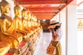 Happy Asian Woman Praying with Buddha