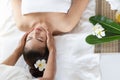 Happy Asian woman receiving head massage, enjoying and relaxing in spa salon Royalty Free Stock Photo