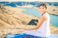 Happy asian woman relaxing and meditating above river valley Royalty Free Stock Photo