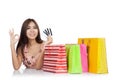 Happy Asian woman show OK with credit cards and shopping bags o Royalty Free Stock Photo